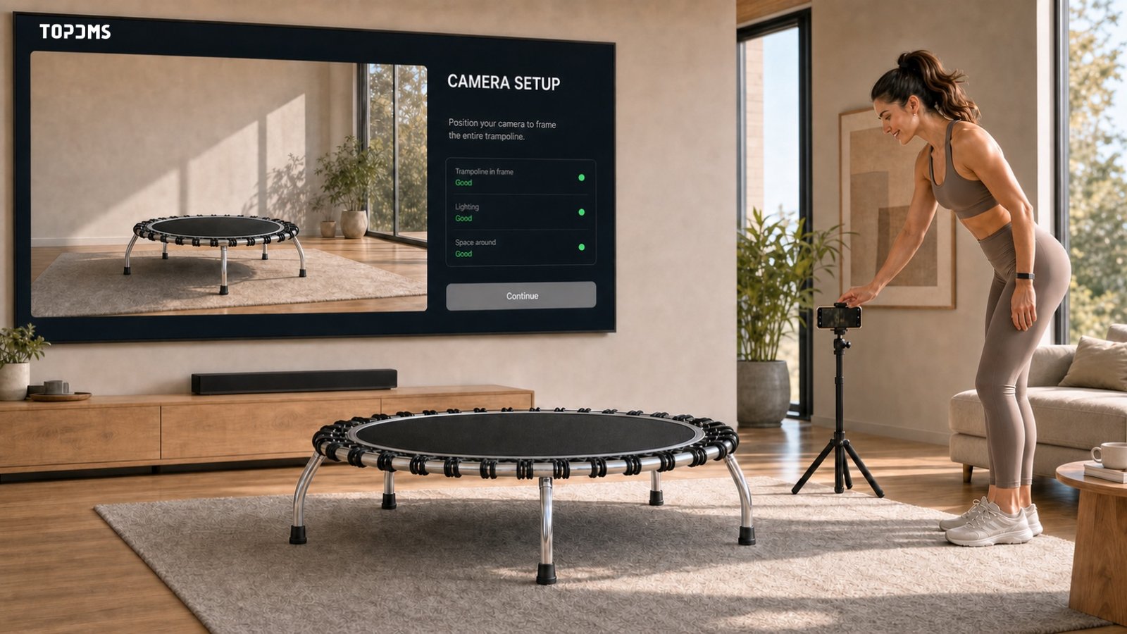 Athlete placing a phone while the screen shows the empty trampoline camera view